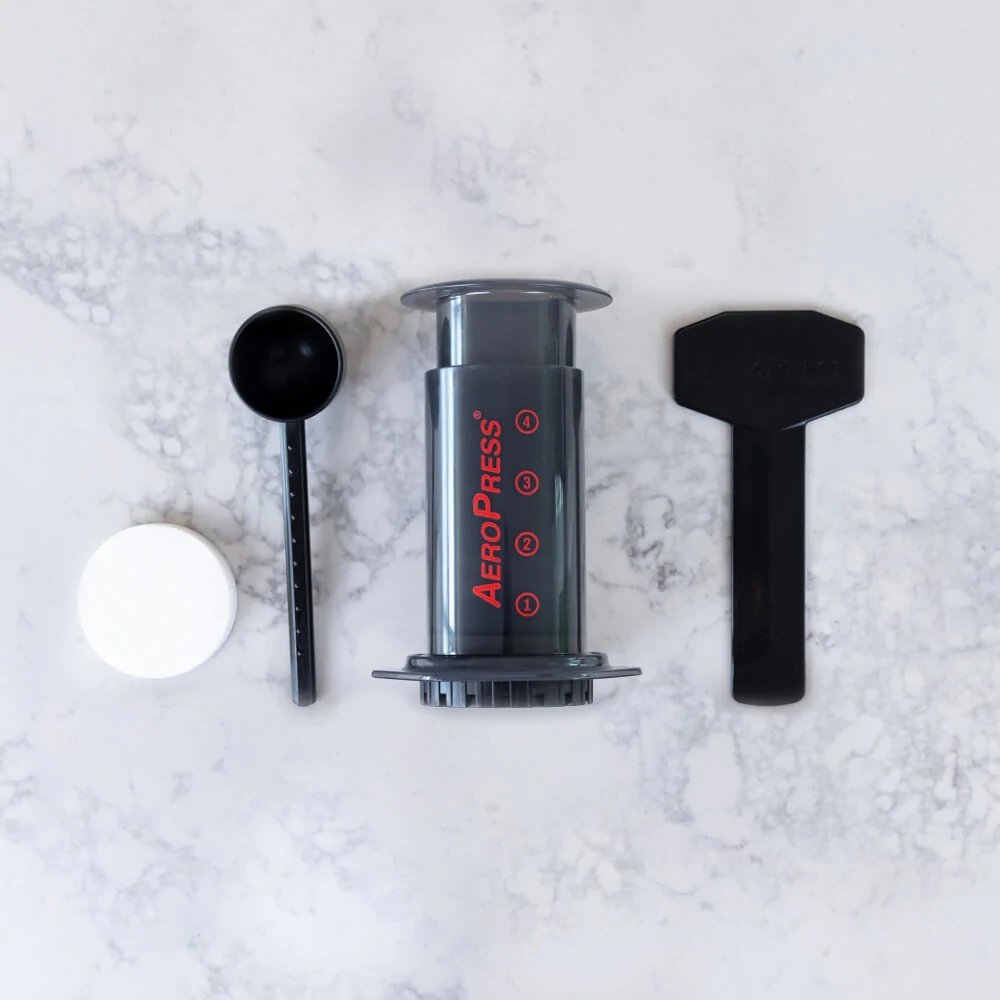 AeroPress® Original Coffee Maker with Tote Bag, Quickly makes delicious coffee without bitterness - 1 to 3 cups per pressing - Watch&Puck