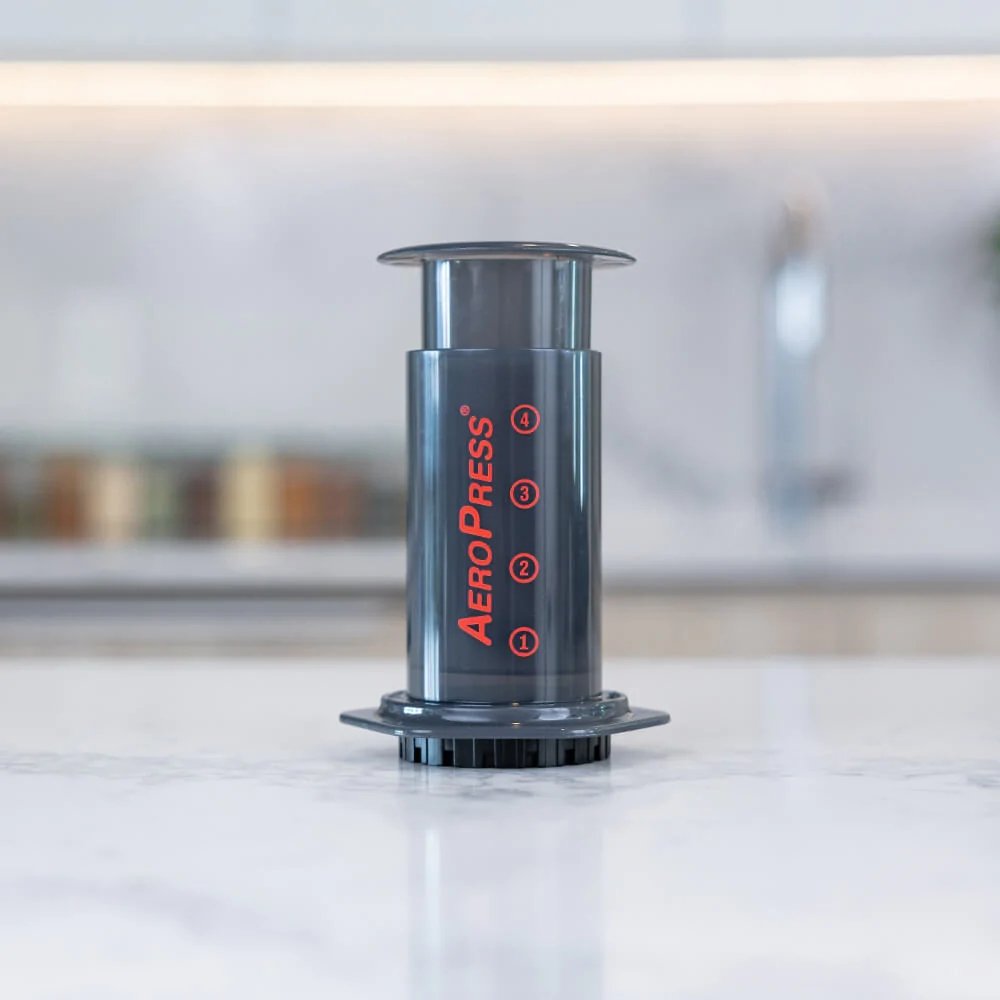 AeroPress® Original Coffee Maker with Tote Bag, Quickly makes delicious coffee without bitterness - 1 to 3 cups per pressing - Watch&Puck